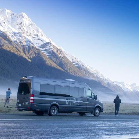 a man standing on top of a snow covered mountain