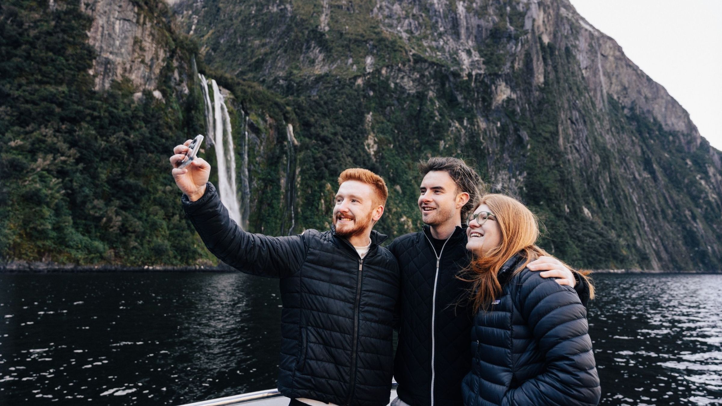 a person standing next to a river