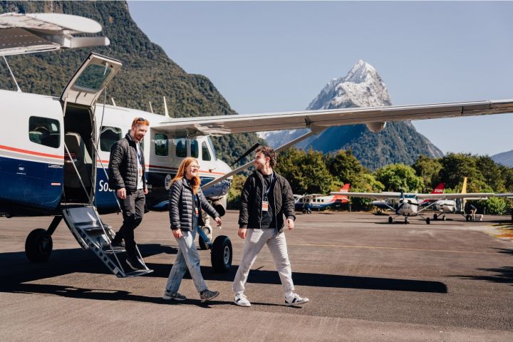 a group of people standing in a parking lot