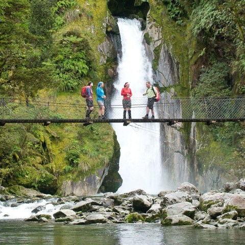 a large waterfall over some water