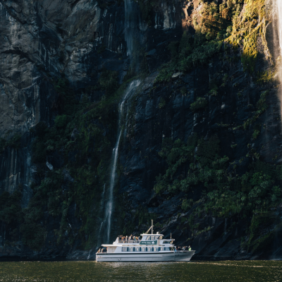 a large waterfall seen from a boat