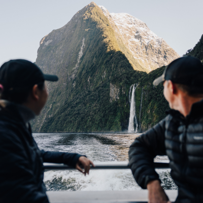 a man standing in front of a mountain